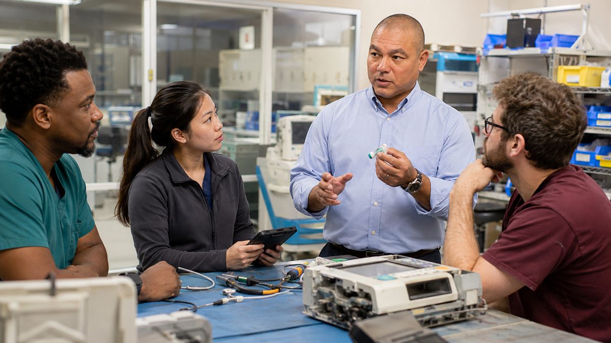 BiomedRx technician performing healthcare technology management consulting to protect patient safety